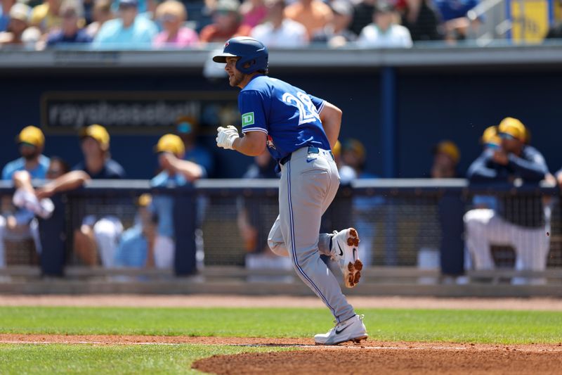 Mar 11, 2024; Port Charlotte, Florida, USA;  Toronto Blue Jays shortstop Ernie Clement (28) hits a two-run home run against the Tampa Bay Rays in the second inning at Charlotte Sports Park. Mandatory Credit: Nathan Ray Seebeck-USA TODAY Sports