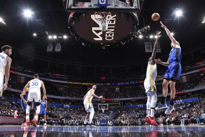 ORLANDO, FL - MARCH 27: Franz Wagner #22 of the Orlando Magic drives to the basket during the game against the Golden State Warriors on March 27, 2024 at Amway Center in Orlando, Florida. NOTE TO USER: User expressly acknowledges and agrees that, by downloading and or using this photograph, User is consenting to the terms and conditions of the Getty Images License Agreement. Mandatory Copyright Notice: Copyright 2024 NBAE (Photo by Fernando Medina/NBAE via Getty Images)