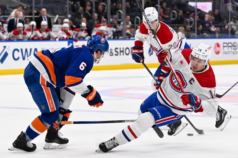 Apr 11, 2024; Elmont, New York, USA; New York Islanders defenseman Ryan Pulock (6) checks Montreal Canadiens center Nick Suzuki (14) during the first period at UBS Arena. Mandatory Credit: Dennis Schneidler-USA TODAY Sports