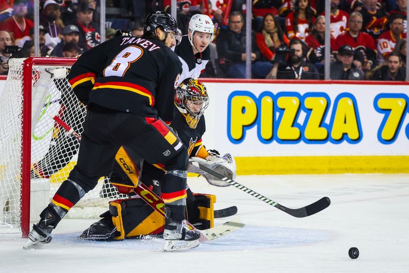 Dec 9, 2023; Calgary, Alberta, CAN; Calgary Flames goaltender Dustin Wolf (32) guards his net against the New Jersey Devils during the third period at Scotiabank Saddledome. Mandatory Credit: Sergei Belski-USA TODAY Sports