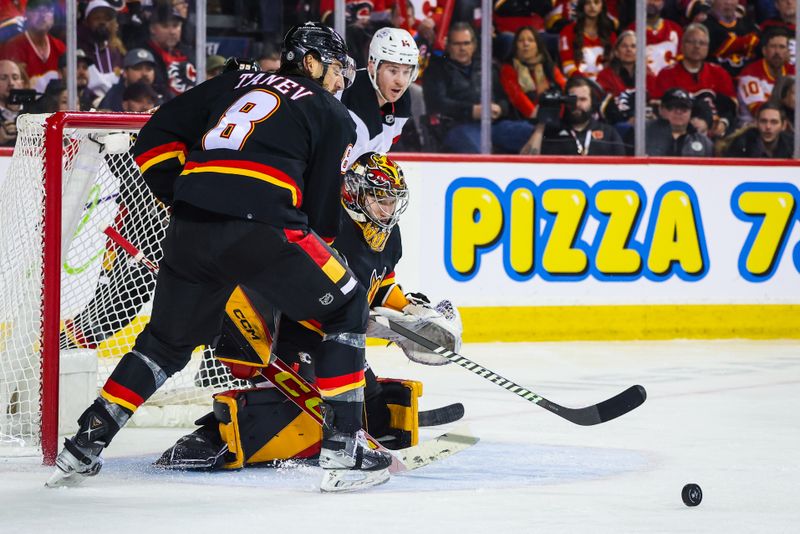 Dec 9, 2023; Calgary, Alberta, CAN; Calgary Flames goaltender Dustin Wolf (32) guards his net against the New Jersey Devils during the third period at Scotiabank Saddledome. Mandatory Credit: Sergei Belski-USA TODAY Sports