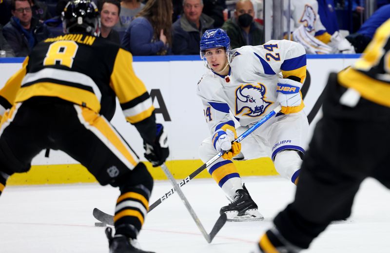 Dec 9, 2022; Buffalo, New York, USA;  Buffalo Sabres center Dylan Cozens (24) looks to make a pass during the second period against the Pittsburgh Penguins at KeyBank Center. Mandatory Credit: Timothy T. Ludwig-USA TODAY Sports