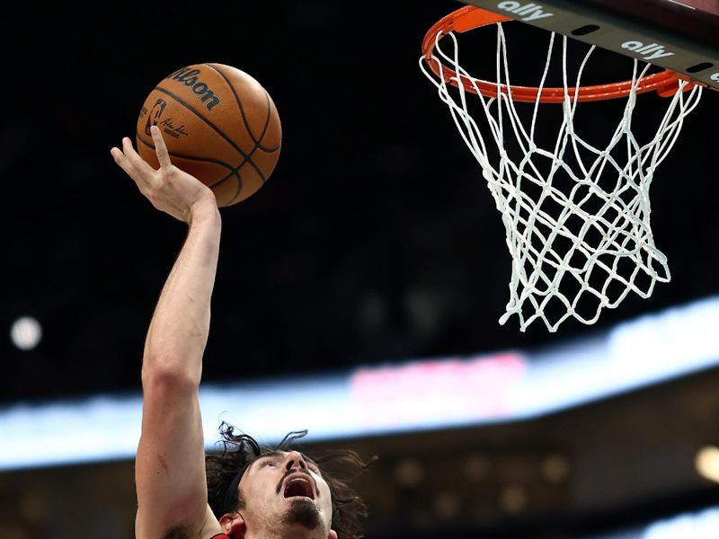 CHARLOTTE, NORTH CAROLINA - NOVEMBER 27: Jaime Jaquez Jr. #11 of the Miami Heat attempts a lay up during the second half of the game against the Charlotte Hornets at Spectrum Center on November 27, 2024 in Charlotte, North Carolina. NOTE TO USER: User expressly acknowledges and agrees that, by downloading and or using this photograph, User is consenting to the terms and conditions of the Getty Images License Agreement. (Photo by Jared C. Tilton/Getty Images)