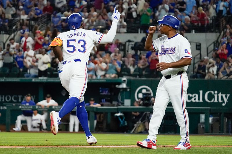 May 18, 2024; Arlington, Texas, USA; Texas Rangers right fielder Adolis Garcia (53) runs the bases after hitting a solo home run during the sixth inning against the Los Angeles Angels at Globe Life Field. Mandatory Credit: Raymond Carlin III-USA TODAY Sports