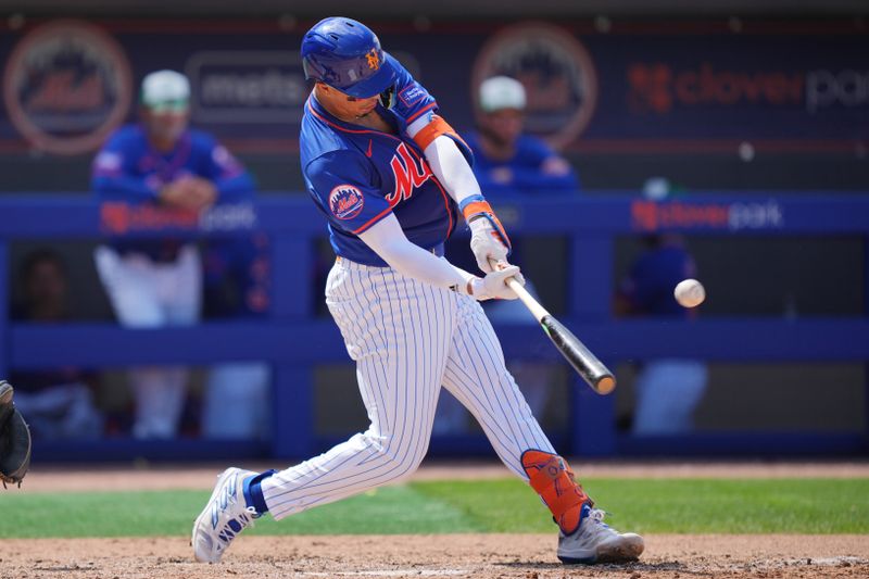 Mar 17, 2024; Port St. Lucie, Florida, USA;  New York Mets third baseman Mark Vientos (27) hits a three-run home run in the sixth inning against the Miami Marlins at Clover Park. Mandatory Credit: Jim Rassol-USA TODAY Sports