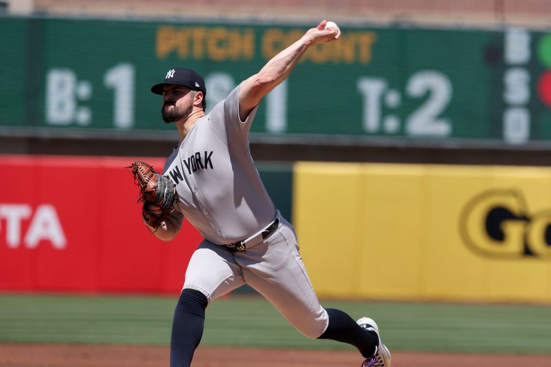 May 10, 2025; West Sacramento, California, USA; New York Yankees starting pitcher Carlos Rodon (55) throws a pitch against the Athletics during the first inning at Sutter Health Park. Mandatory Credit: Dennis Lee-Imagn Images