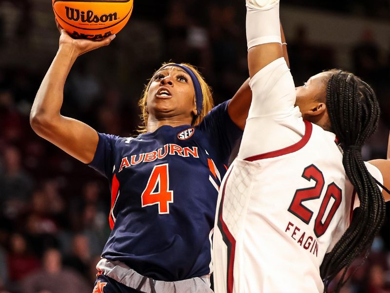 Jan 5, 2023; Columbia, South Carolina, USA; Auburn Tigers guard Kaitlyn Duhon (4) shoots over South Carolina Gamecocks forward Sania Feagin (20) in the second half at Colonial Life Arena. Mandatory Credit: Jeff Blake-USA TODAY Sports