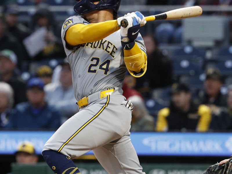 Apr 24, 2024; Pittsburgh, Pennsylvania, USA;  Milwaukee Brewers catcher William Contreras (24) hits a single against the Pittsburgh Pirates during the fourth inning at PNC Park. Mandatory Credit: Charles LeClaire-USA TODAY Sports