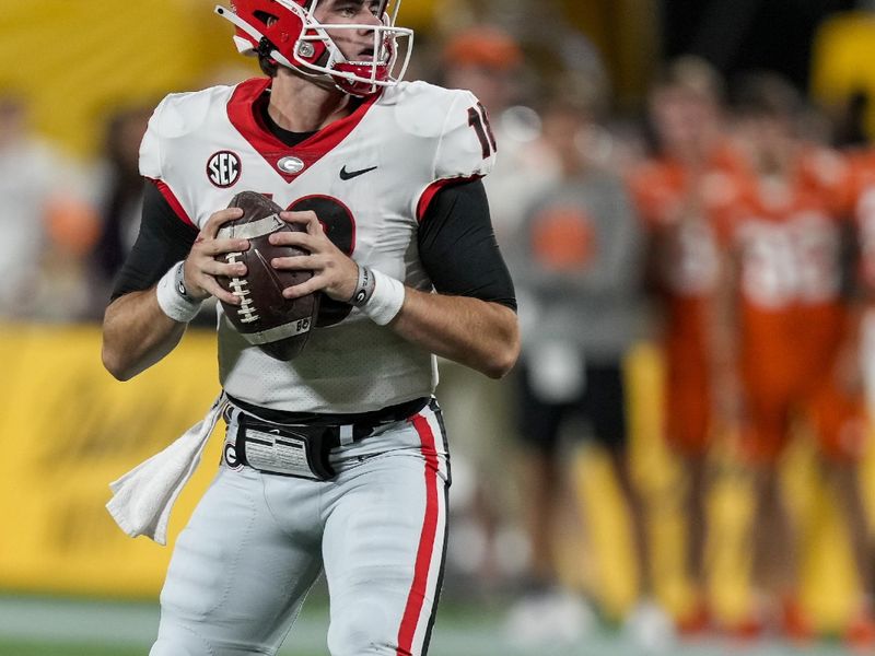 Sep 4, 2021; Charlotte, North Carolina, USA; Georgia Bulldogs quarterback JT Daniels (18) looks for his receiver against the Clemson Tigers during the first quarter at Bank of America Stadium. Mandatory Credit: Jim Dedmon-USA TODAY Sports