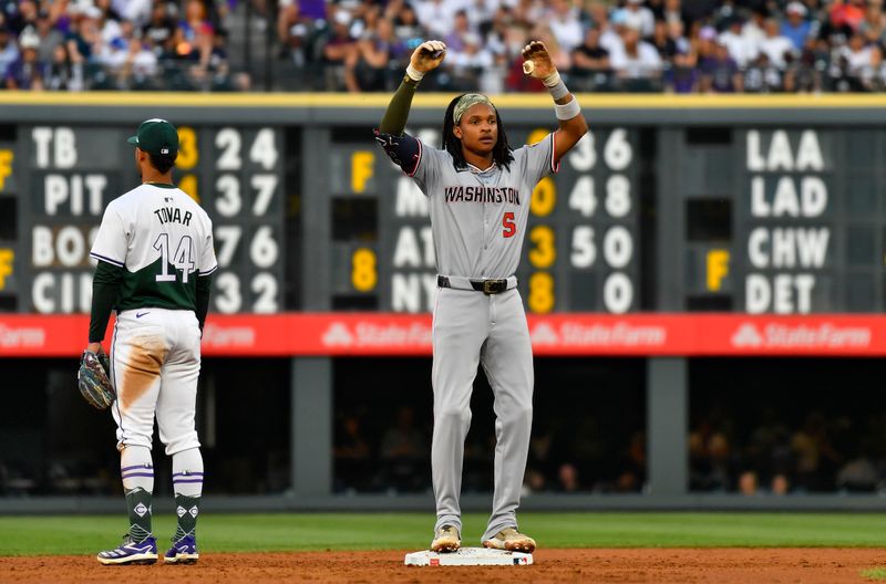 Jun 22, 2024; Denver, Colorado, USA;  Washington Nationals shortstop CJ Abrams (5) reacts after hitting a double against the Colorado Rockies in the third inning at Coors Field. Mandatory Credit: John Leyba-USA TODAY Sports