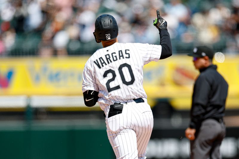 May 25, 2025; Chicago, Illinois, USA; Chicago White Sox third baseman Miguel Vargas (20) rounds the bases after hitting a solo home run against the Texas Rangers during the fourth inning at Rate Field. Mandatory Credit: Kamil Krzaczynski-Imagn Images