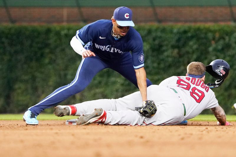 Jul 14, 2023; Chicago, Illinois, USA; Boston Red Sox right fielder Alex Verdugo (99) steals second base as Chicago Cubs second baseman Christopher Morel (5) takes a late throw during the third inning at Wrigley Field. Mandatory Credit: David Banks-USA TODAY Sports