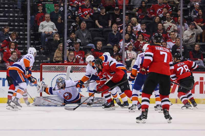 Oct 25, 2024; Newark, New Jersey, USA; New Jersey Devils left wing Jesper Bratt (63) scores a goal on New York Islanders goaltender Ilya Sorokin (30) during the third period at Prudential Center. Mandatory Credit: Ed Mulholland-Imagn Images