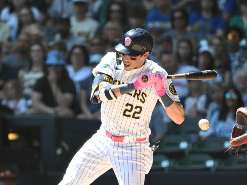 May 12, 2024; Milwaukee, Wisconsin, USA; Milwaukee Brewers outfielder Christian Yelich (22) reacts to an inside pitch against the St. Louis Cardinals in the first inning at American Family Field. Mandatory Credit: Michael McLoone-USA TODAY Sports