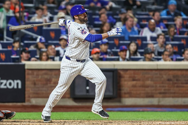 Aug 20, 2024; New York City, New York, USA;  New York Mets designated hitter J.D. Martinez (28) hits a three-run home run in the eighth inning against the Baltimore Orioles at Citi Field. Mandatory Credit: Wendell Cruz-USA TODAY Sports