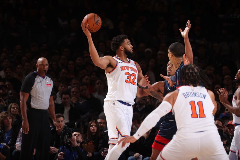 NEW YORK, NY - NOVEMBER 18: Karl-Anthony Towns #32 of the New York Knicks looks to pass the ball during the game against the Washington Wizards on November 18, 2024 at Madison Square Garden in New York City, New York.  NOTE TO USER: User expressly acknowledges and agrees that, by downloading and or using this photograph, User is consenting to the terms and conditions of the Getty Images License Agreement. Mandatory Copyright Notice: Copyright 2024 NBAE  (Photo by Nathaniel S. Butler/NBAE via Getty Images)