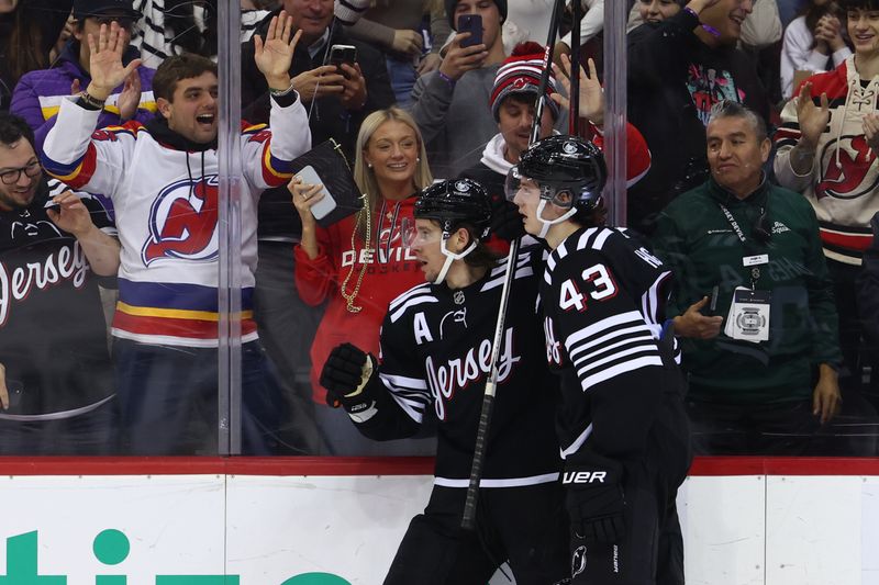 Jan 6, 2024; Newark, New Jersey, USA; New Jersey Devils left wing Erik Haula (56) celebrates his goal against the Vancouver Canucks during the second period at Prudential Center. Mandatory Credit: Ed Mulholland-USA TODAY Sports