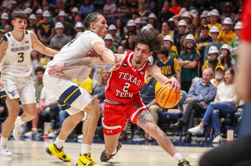 Mar 2, 2024; Morgantown, West Virginia, USA; Texas Tech Red Raiders guard Pop Isaacs (2) drives baseline against West Virginia Mountaineers forward Patrick Suemnick (24) during the first half at WVU Coliseum. Mandatory Credit: Ben Queen-USA TODAY Sports