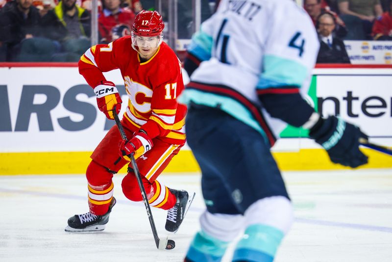 Mar 4, 2024; Calgary, Alberta, CAN; Calgary Flames center Yegor Sharangovich (17) controls the puck against the Seattle Kraken during the second period at Scotiabank Saddledome. Mandatory Credit: Sergei Belski-USA TODAY Sports