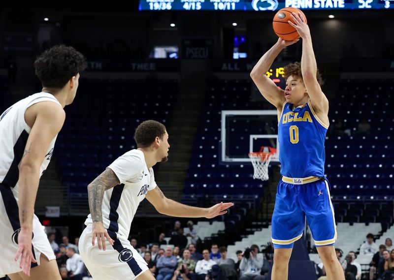 Jan 14, 2026; University Park, Pennsylvania, USA; UCLA Bruins guard Trent Perry (0) passes the ball as Penn State Nittany Lions guard Eli Rice (11) defends during the second half at Bryce Jordan Center. Mandatory Credit: Matthew O'Haren-Imagn Images