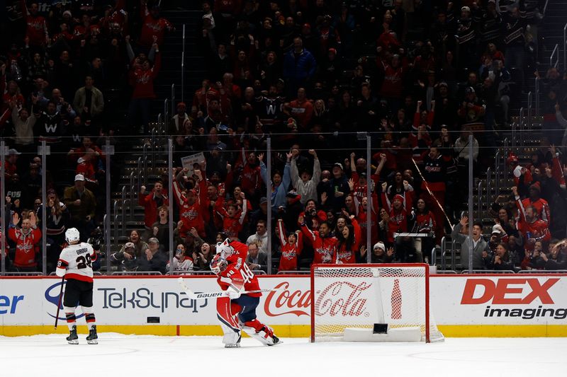 Mar 3, 2025; Washington, District of Columbia, USA; Washington Capitals goaltender Logan Thompson (48) celebrates after making the game-winning save on Ottawa Senators right wing Claude Giroux (28) in a shootout at Capital One Arena. Mandatory Credit: Geoff Burke-Imagn Images