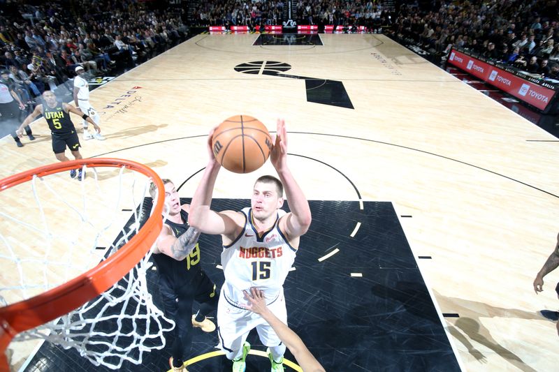 SALT LAKE CITY, UT - APRIL 9: Nikola Jokic #15 of the Denver Nuggets shoots the ball during the game against the Utah Jazz on April 9, 2024 at Delta Center in Salt Lake City, Utah. NOTE TO USER: User expressly acknowledges and agrees that, by downloading and or using this Photograph, User is consenting to the terms and conditions of the Getty Images License Agreement. Mandatory Copyright Notice: Copyright 2024 NBAE (Photo by Melissa Majchrzak/NBAE via Getty Images)