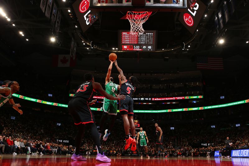 TORONTO, CANADA - JANUARY 15:  Derrick White #9 of the Boston Celtics drives to the basket during the game against th eToronto Raptors on January 15, 2024 at the Scotiabank Arena in Toronto, Ontario, Canada.  NOTE TO USER: User expressly acknowledges and agrees that, by downloading and or using this Photograph, user is consenting to the terms and conditions of the Getty Images License Agreement.  Mandatory Copyright Notice: Copyright 2024 NBAE (Photo by Vaughn Ridley/NBAE via Getty Images)