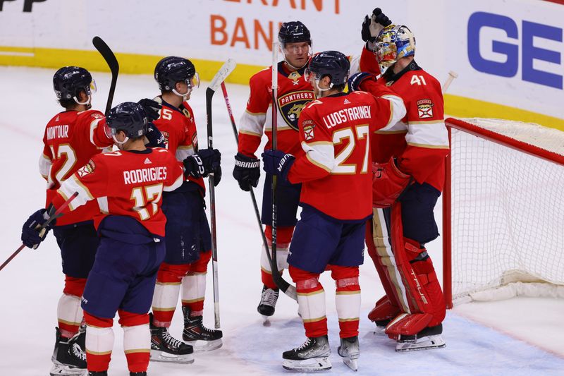 Apr 9, 2024; Sunrise, Florida, USA; Florida Panthers goaltender Anthony Stolarz (41) celebrates with teammates after the game against the Ottawa Senators at Amerant Bank Arena. Mandatory Credit: Sam Navarro-USA TODAY Sports