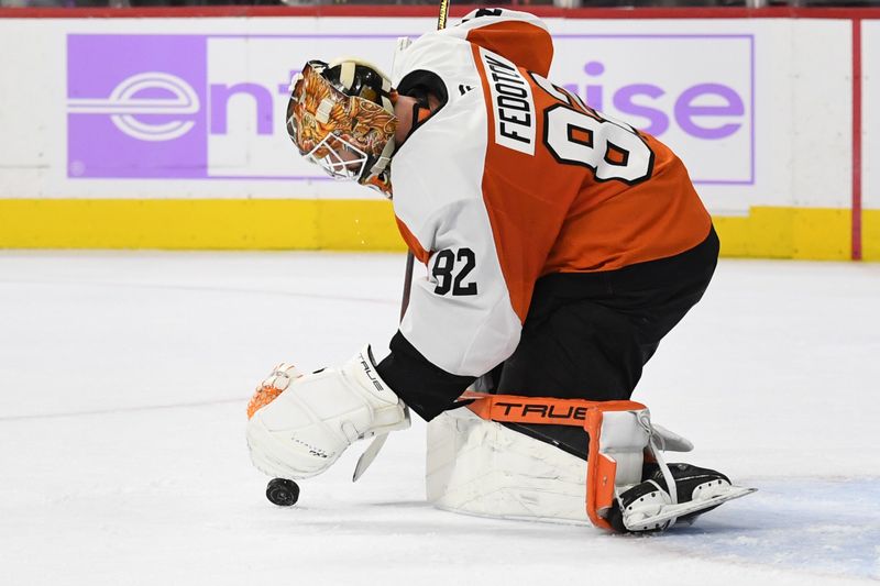 Nov 25, 2024; Philadelphia, Pennsylvania, USA; Philadelphia Flyers goaltender Ivan Fedotov (82) makes a save against the Vegas Golden Knights during the second period at Wells Fargo Center. Mandatory Credit: Eric Hartline-Imagn Images