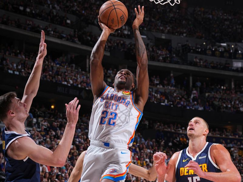 DENVER, CO - MAY 11: Cason Wallace #22 of the Oklahoma City Thunder drives to the basket during the game against the Denver Nuggets during Round 2 Game 4 of the 2025 NBA Playoffs on May 11, 2025 at Ball Arena in Denver, Colorado. NOTE TO USER: User expressly acknowledges and agrees that, by downloading and/or using this Photograph, user is consenting to the terms and conditions of the Getty Images License Agreement. Mandatory Copyright Notice: Copyright 2025 NBAE(Photo by Garrett Ellwood/NBAE via Getty Images)