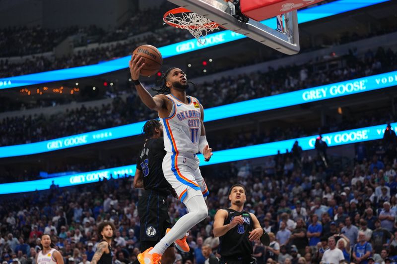 DALLAS, TX - MAY 18: Isaiah Joe #11 of the Oklahoma City Thunder drives to the basket during the game against the Dallas Mavericks during Round 2 Game 6 of the 2024 NBA Playoffs on May 18, 2024 at the American Airlines Center in Dallas, Texas. NOTE TO USER: User expressly acknowledges and agrees that, by downloading and or using this photograph, User is consenting to the terms and conditions of the Getty Images License Agreement. Mandatory Copyright Notice: Copyright 2024 NBAE (Photo by Cooper Neill/NBAE via Getty Images)