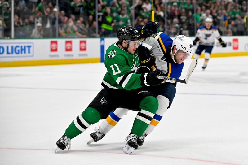 Apr 17, 2024; Dallas, Texas, USA; St. Louis Blues defenseman Scott Perunovich (48) is called for a penalty on Dallas Stars center Logan Stankoven (11) during the overtime third period at the American Airlines Center. Mandatory Credit: Jerome Miron-USA TODAY Sports