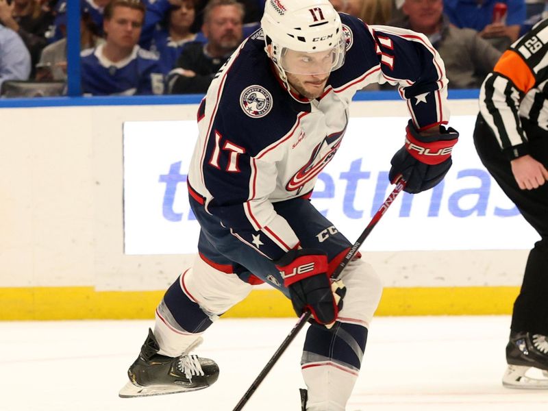 Apr 9, 2024; Tampa, Florida, USA; Columbus Blue Jackets right wing Justin Danforth (17) shoots the puck against the Tampa Bay Lightning during the second period at Amalie Arena. Mandatory Credit: Kim Klement Neitzel-USA TODAY Sports