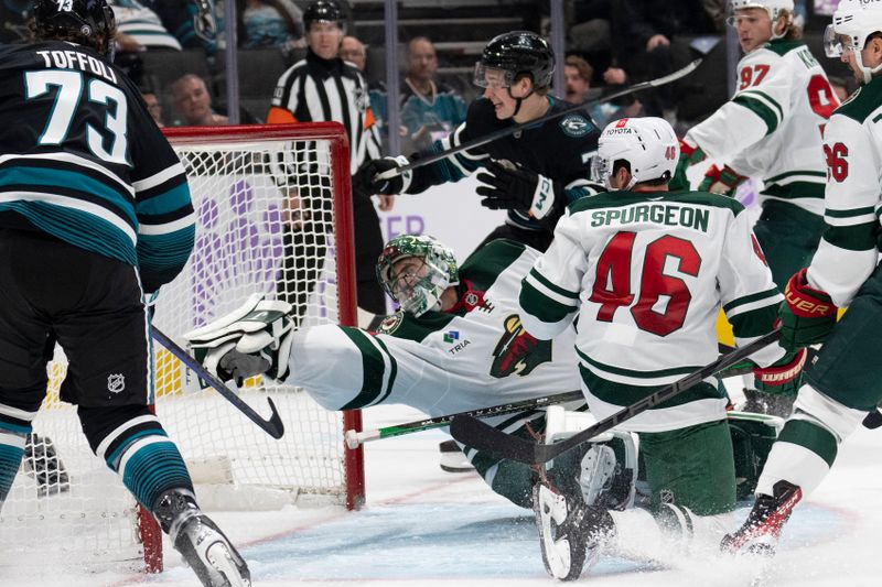 Nov 7, 2024; San Jose, California, USA;  Minnesota Wild goaltender Marc-Andre Fleury (29) reaches for the puck during the second period against the San Jose Sharks at SAP Center at San Jose. Mandatory Credit: Stan Szeto-Imagn Images