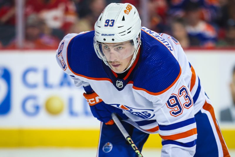 Apr 6, 2024; Calgary, Alberta, CAN; Edmonton Oilers center Ryan Nugent-Hopkins (93) during the face off against the Calgary Flames during the third period at Scotiabank Saddledome. Mandatory Credit: Sergei Belski-USA TODAY Sports