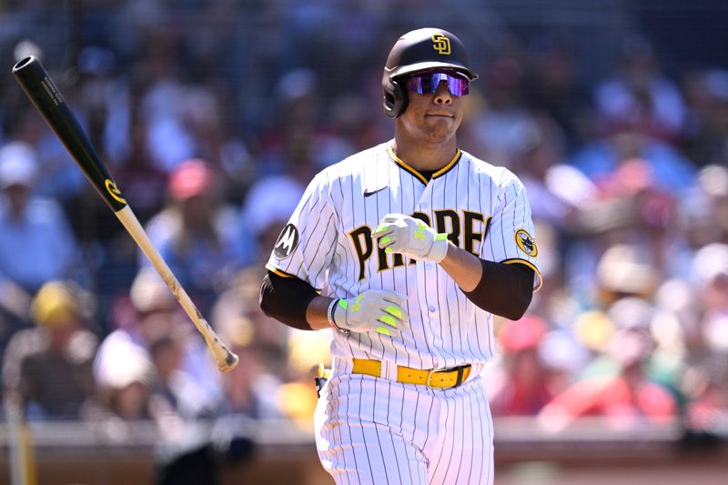 Sep 6, 2023; San Diego, California, USA; San Diego Padres left fielder Juan Soto (22) tosses his bat after a walk during the fourth inning against the Philadelphia Phillies at Petco Park. Mandatory Credit: Orlando Ramirez-USA TODAY Sports