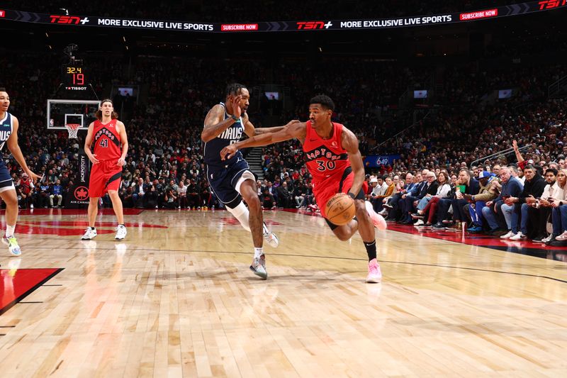 TORONTO, CANADA - FEBRUARY 28: Ochai Agbaji #30 of the Toronto Raptors dribbles the ball during the game against the Dallas Mavericks on February 28, 2024 at the Scotiabank Arena in Toronto, Ontario, Canada.  NOTE TO USER: User expressly acknowledges and agrees that, by downloading and or using this Photograph, user is consenting to the terms and conditions of the Getty Images License Agreement.  Mandatory Copyright Notice: Copyright 2024 NBAE (Photo by Vaughn Ridley/NBAE via Getty Images)