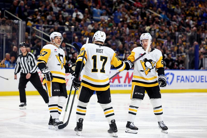 Jan 17, 2025; Buffalo, New York, USA;  Pittsburgh Penguins right wing Bryan Rust (17) celebrates his goal with teammates during the third period against the Buffalo Sabres at KeyBank Center. Mandatory Credit: Timothy T. Ludwig-Imagn Images