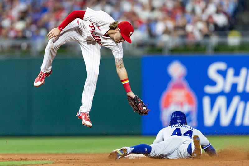 Aug 4, 2023; Philadelphia, Pennsylvania, USA; Kansas City Royals left fielder Dairon Blanco (44) steals second past Philadelphia Phillies second baseman Bryson Stott (5) during the sixth inning at Citizens Bank Park. Mandatory Credit: Bill Streicher-USA TODAY Sports