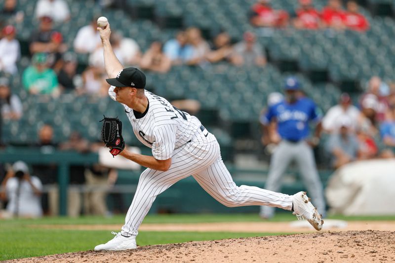 Jul 9, 2025; Chicago, Illinois, USA; Chicago White Sox relief pitcher Jordan Leasure (49) delivers a pitch against the Toronto Blue Jays during the ninth inning at Rate Field. Mandatory Credit: Kamil Krzaczynski-Imagn Images