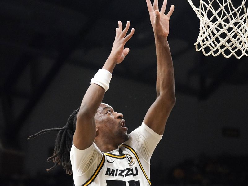 Jan 6, 2024; Columbia, Missouri, USA; Missouri Tigers guard Sean East II (55) shoots as Georgia Bulldogs forward Jalen DeLoach (23) looks on during the first half at Mizzou Arena. Mandatory Credit: Denny Medley-USA TODAY Sports