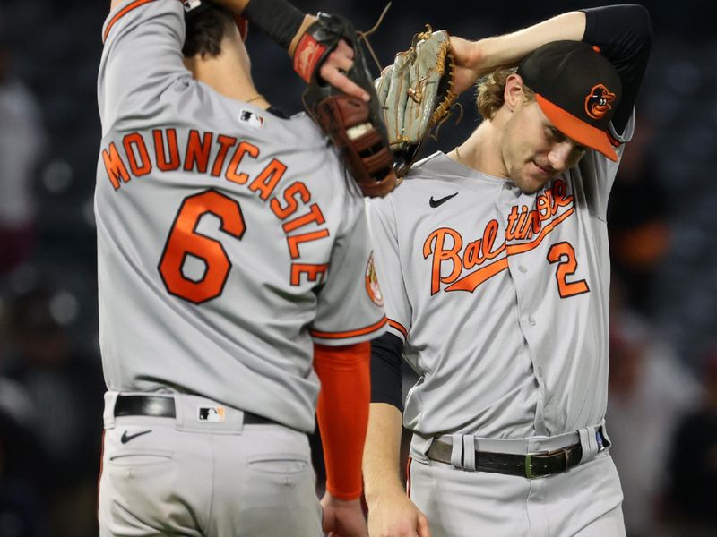 Sep 6, 2023; Anaheim, California, USA; Baltimore Orioles first baseman Ryan Mountcastle (6) and third baseman Gunnar Henderson (2) celebrate a victory after defeating the Los Angeles Angels 10-3 at Angel Stadium. Mandatory Credit: Kiyoshi Mio-USA TODAY Sports