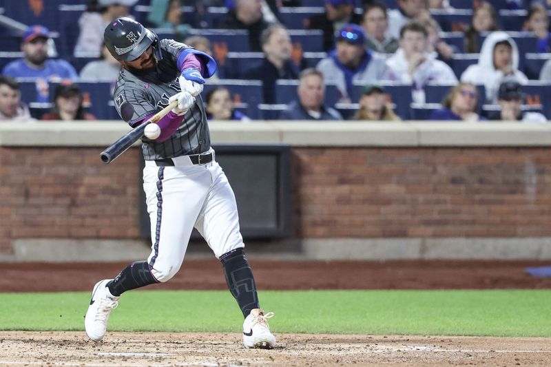 May 24, 2025; New York City, New York, USA;  New York Mets catcher Luis Torrens (13) hits a single in the fourth inning against the Los Angeles Dodgers at Citi Field. Mandatory Credit: Wendell Cruz-Imagn Images
