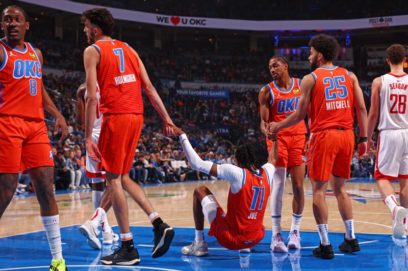 OKLAHOMA CITY, OK - NOVEMBER 8: Isaiah Joe #11 gets helped off the floor my Oklahoma City Thunder teammates during the game against the Houston Rockets on November 8, 2024 at Paycom Center in Oklahoma City, Oklahoma. NOTE TO USER: User expressly acknowledges and agrees that, by downloading and or using this photograph, User is consenting to the terms and conditions of the Getty Images License Agreement. Mandatory Copyright Notice: Copyright 2024 NBAE (Photo by Zach Beeker/NBAE via Getty Images)