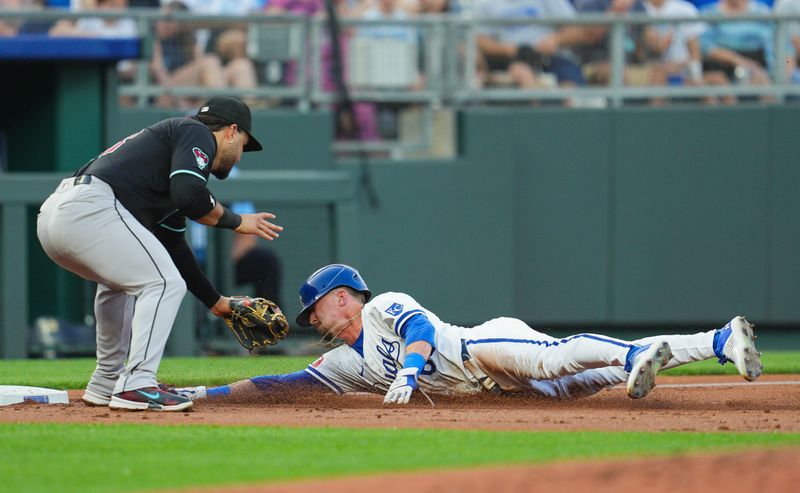 Jul 22, 2024; Kansas City, Missouri, USA; Kansas City Royals left fielder Drew Waters (6) slides safely into third base against Arizona Diamondbacks third baseman Eugenio Suarez (28) during the second inning at Kauffman Stadium. Mandatory Credit: Jay Biggerstaff-USA TODAY Sports