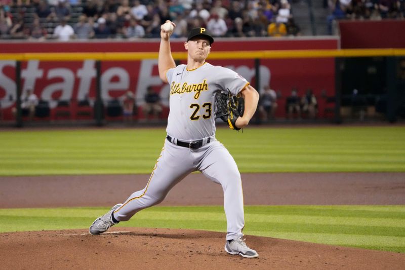 Jul 8, 2023; Phoenix, Arizona, USA; Pittsburgh Pirates starting pitcher Mitch Keller (23) pitches against the Arizona Diamondbacks during the first inning at Chase Field. Mandatory Credit: Joe Camporeale-USA TODAY Sports