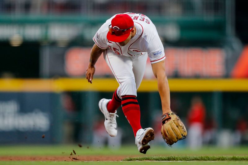 Apr 18, 2023; Cincinnati, Ohio, USA; Cincinnati Reds third baseman Nick Senzel (15) commits a fielding error hit by Tampa Bay Rays first baseman Yandy Diaz (not pictured) in the fifth inning at Great American Ball Park. Mandatory Credit: Katie Stratman-USA TODAY Sports