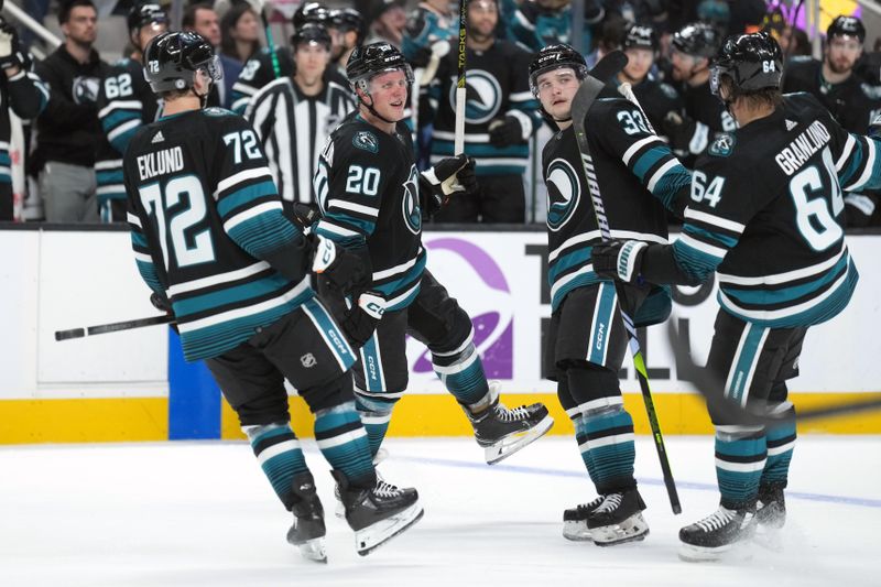 Feb 17, 2024; San Jose, California, USA; San Jose Sharks left wing Fabian Zetterlund (20) celebrates with left wing William Eklund (72) and defenseman Calen Addison (33) and center Mikael Granlund (64) after scoring a goal against the Columbus Blue Jackets during the second period at SAP Center at San Jose. Mandatory Credit: Darren Yamashita-USA TODAY Sports