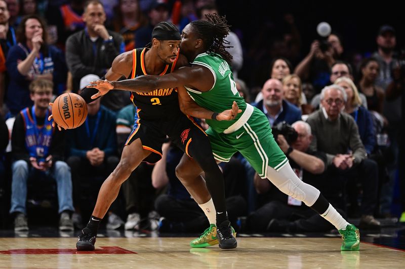 OKLAHOMA CITY, OKLAHOMA - JANUARY 5: Shai Gilgeous-Alexander #2 of the Oklahoma City Thunder handles the ball while being defended by Jrue Holiday #4 of the Boston Celtics during the second half at Paycom Center on January 5, 2025 in Oklahoma City, Oklahoma. NOTE TO USER: User expressly acknowledges and agrees that, by downloading and or using this photograph, User is consenting to the terms and conditions of the Getty Images License Agreement. (Photo by Joshua Gateley/Getty Images)