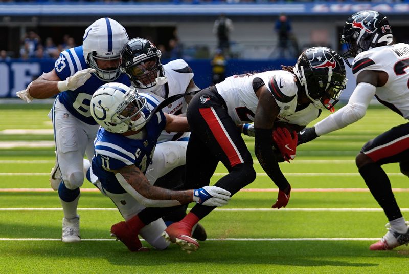 Houston Texans safety Calen Bullock (21) intercepts a pass during the first half of an NFL football game against the Indianapolis Colts, Sunday, Sept. 8, 2024, in Indianapolis. (AP Photo/Darron Cummings)